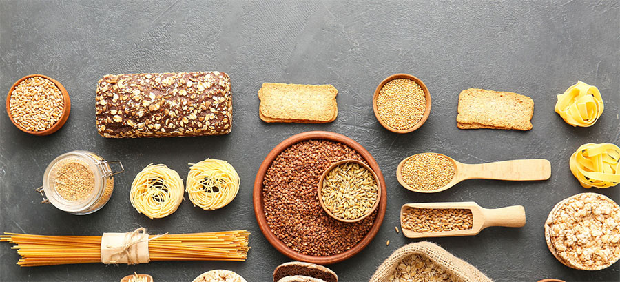 An overhead photo of different types of carbs laid out on a table